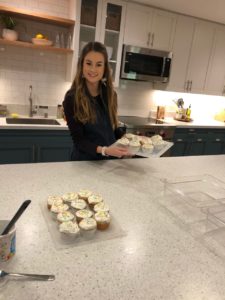 Bailey holding cupcakes