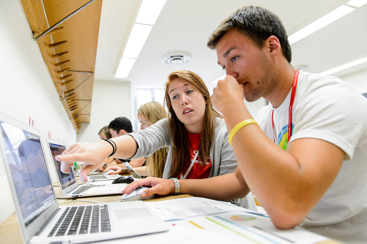 Zoe Hurley (left), peer advisor for the Student Orientation, Advising, and Registration program (SOAR), works with an incoming student Brandon Hamm (right) to create a class schedule during an advising session in Van Vleck Hall at the University of Wisconsin-Madison on July 8, 2015. (Photo by Bryce Richter / UW-Madison)
