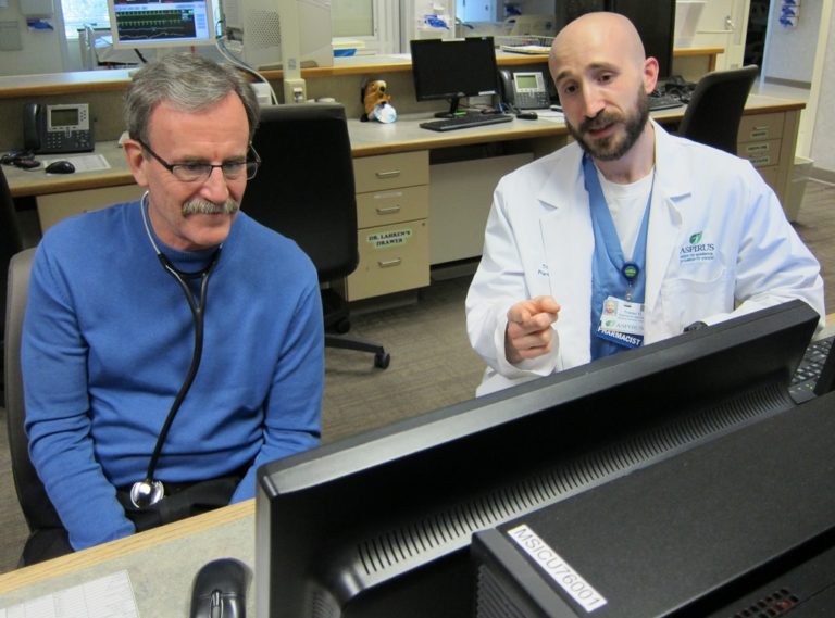 PharmD/MPH student Tristan O'Driscoll works with his mentor, Dr. William Bowler