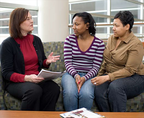 Pre-Pharmacy advisor Amy Zwaska speaks with a prospective student and her mom