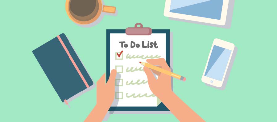 An overhead illustration of a person's hands writing on a "To Do List" on a clipboard, with a checked box at the top. Surrounding the clipboard are a notebook, a coffee cup, a tablet, and a smartphone, all on a light green surface.