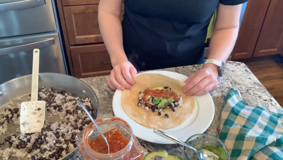 Photo of student wrapping a burrito
