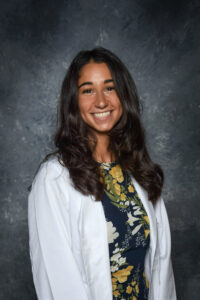portrait of Nourhan El-Sanjak in her white pharmacy coat